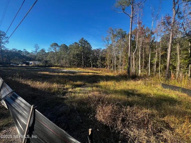 a view of a lake with a yard
