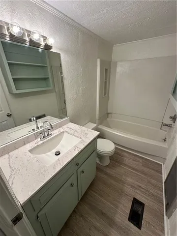 an empty room with a ceiling fan and a window