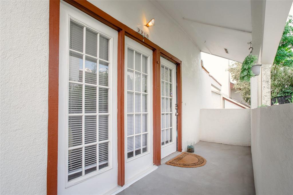 Property entrance with stucco siding