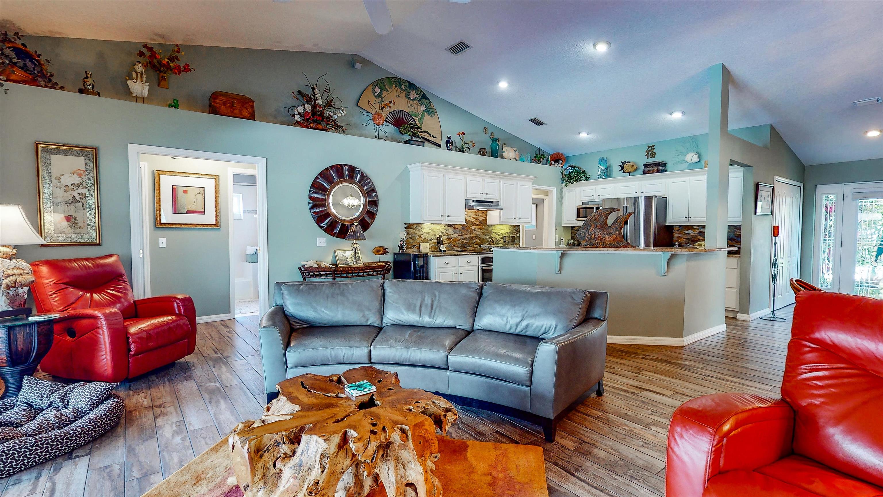 252 Desoto Road St. Augustine, FL 32080 - Photo 14 of 50 a living room with furniture kitchen view and a wooden floor
