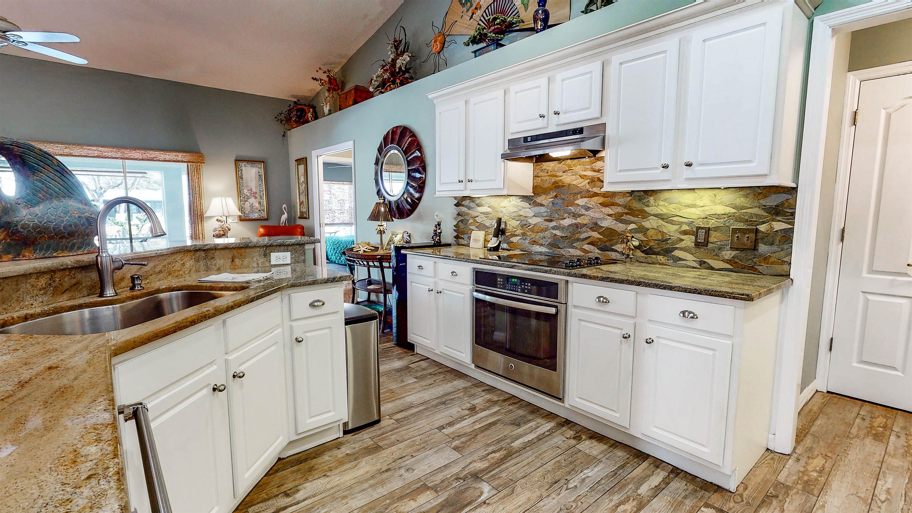 252 Desoto Road St. Augustine, FL 32080 - Photo 20 of 50 a kitchen with granite countertop cabinets stainless steel appliances and a sink