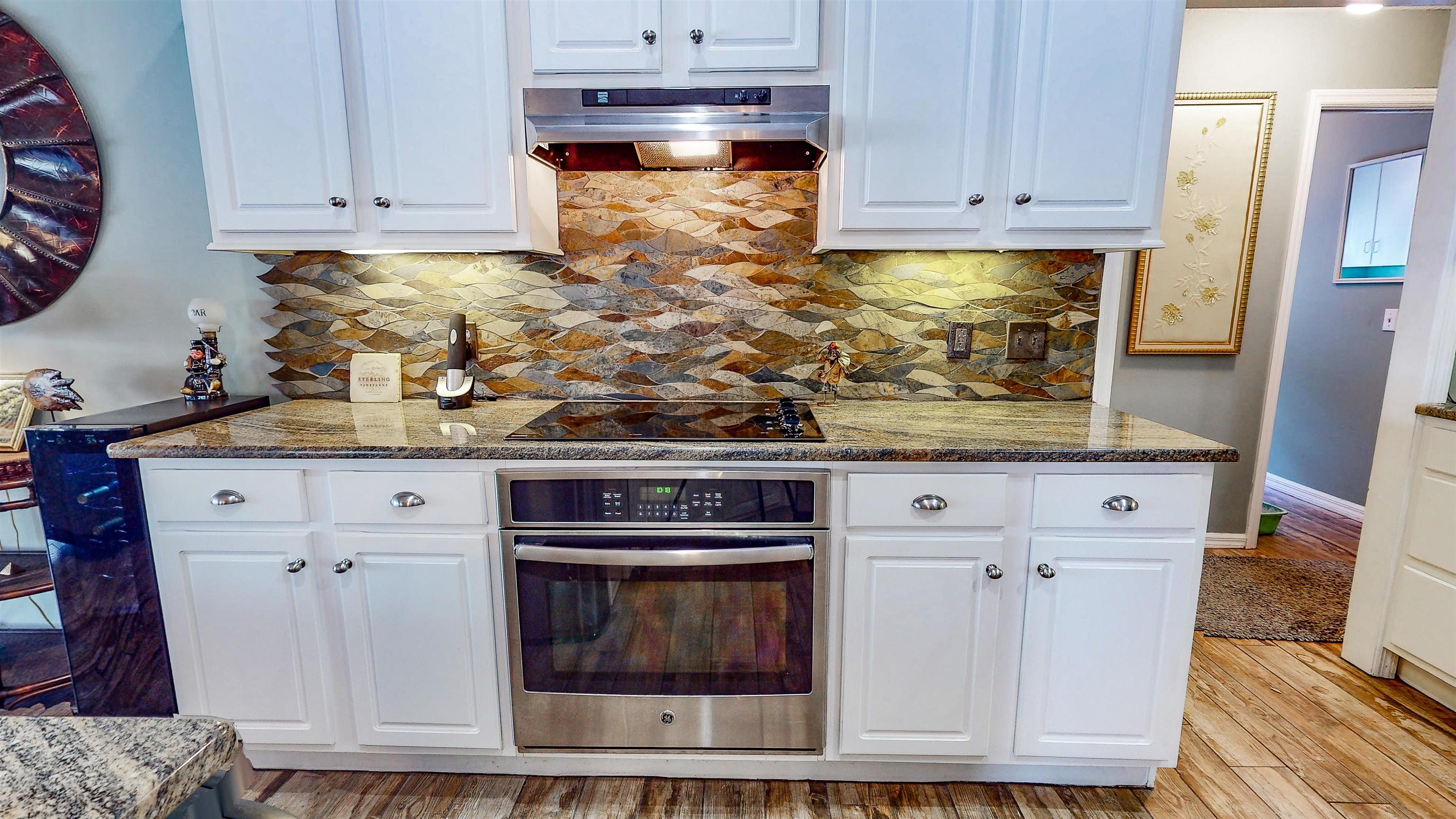 252 Desoto Road St. Augustine, FL 32080 - Photo 22 of 50 a kitchen with stainless steel appliances granite countertop a stove and a white cabinets