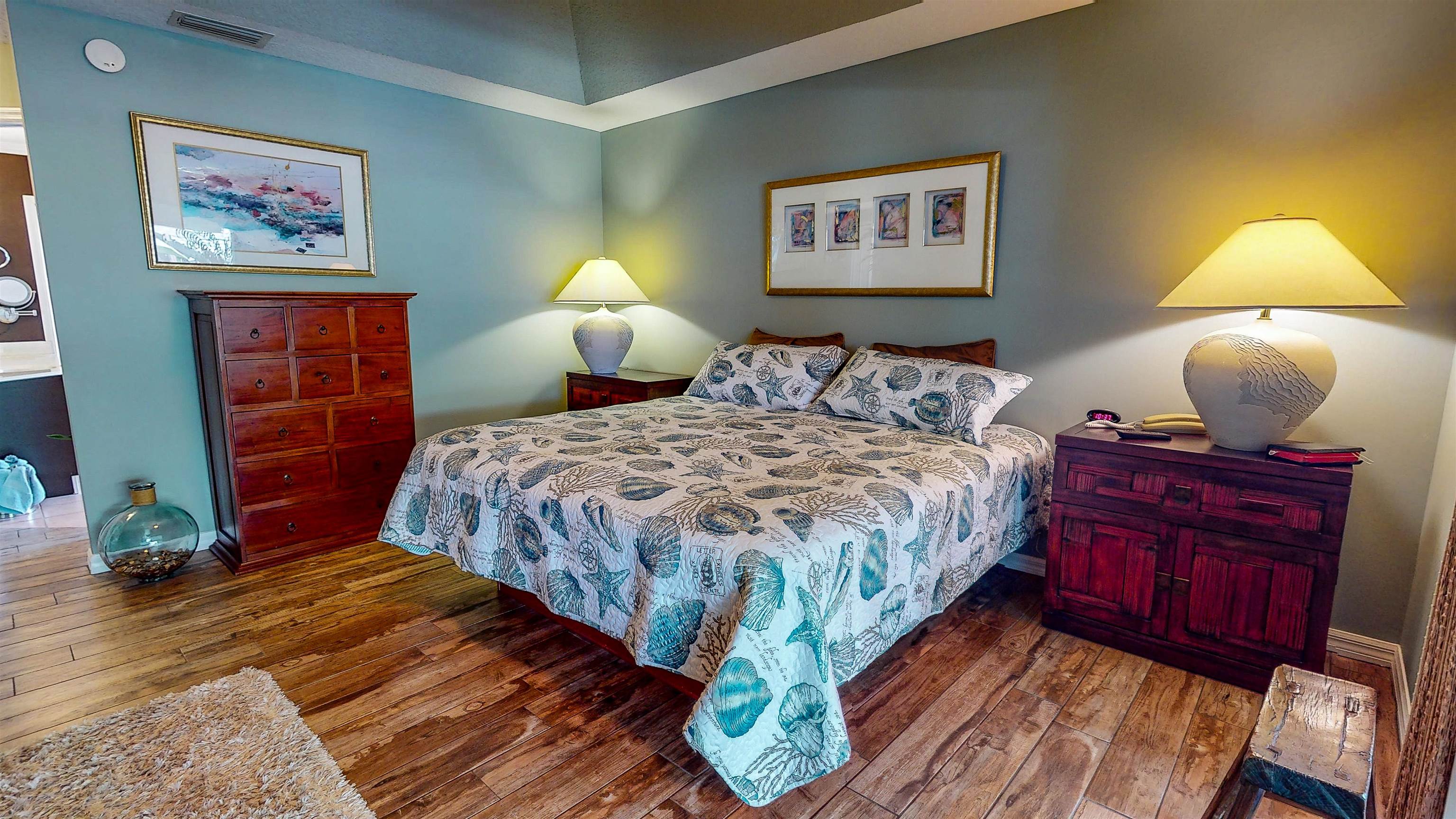 252 Desoto Road St. Augustine, FL 32080 - Photo 25 of 50 a bedroom with bed and wooden floor