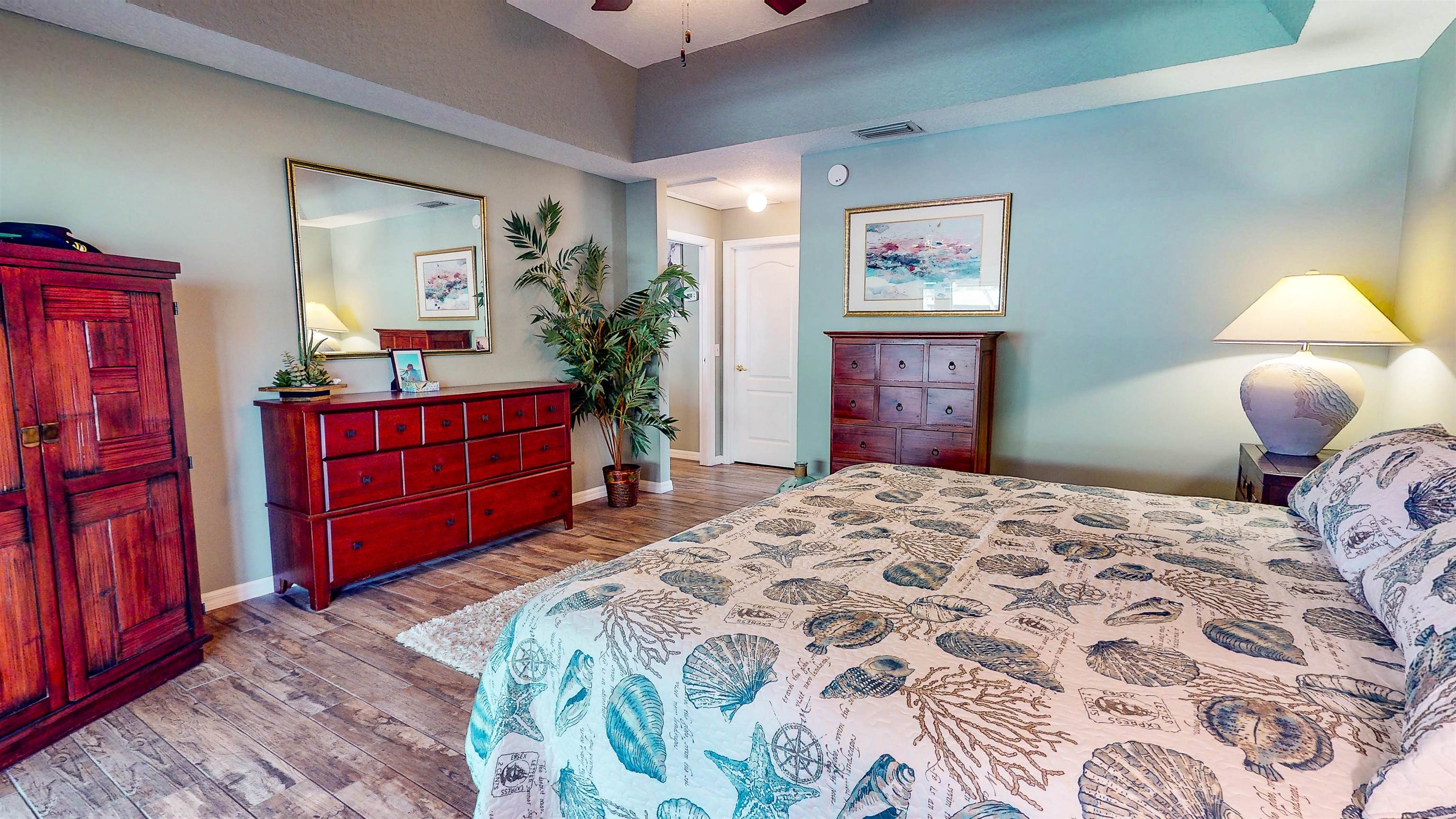 252 Desoto Road St. Augustine, FL 32080 - Photo 27 of 50 a bedroom with a bed and a dresser in it