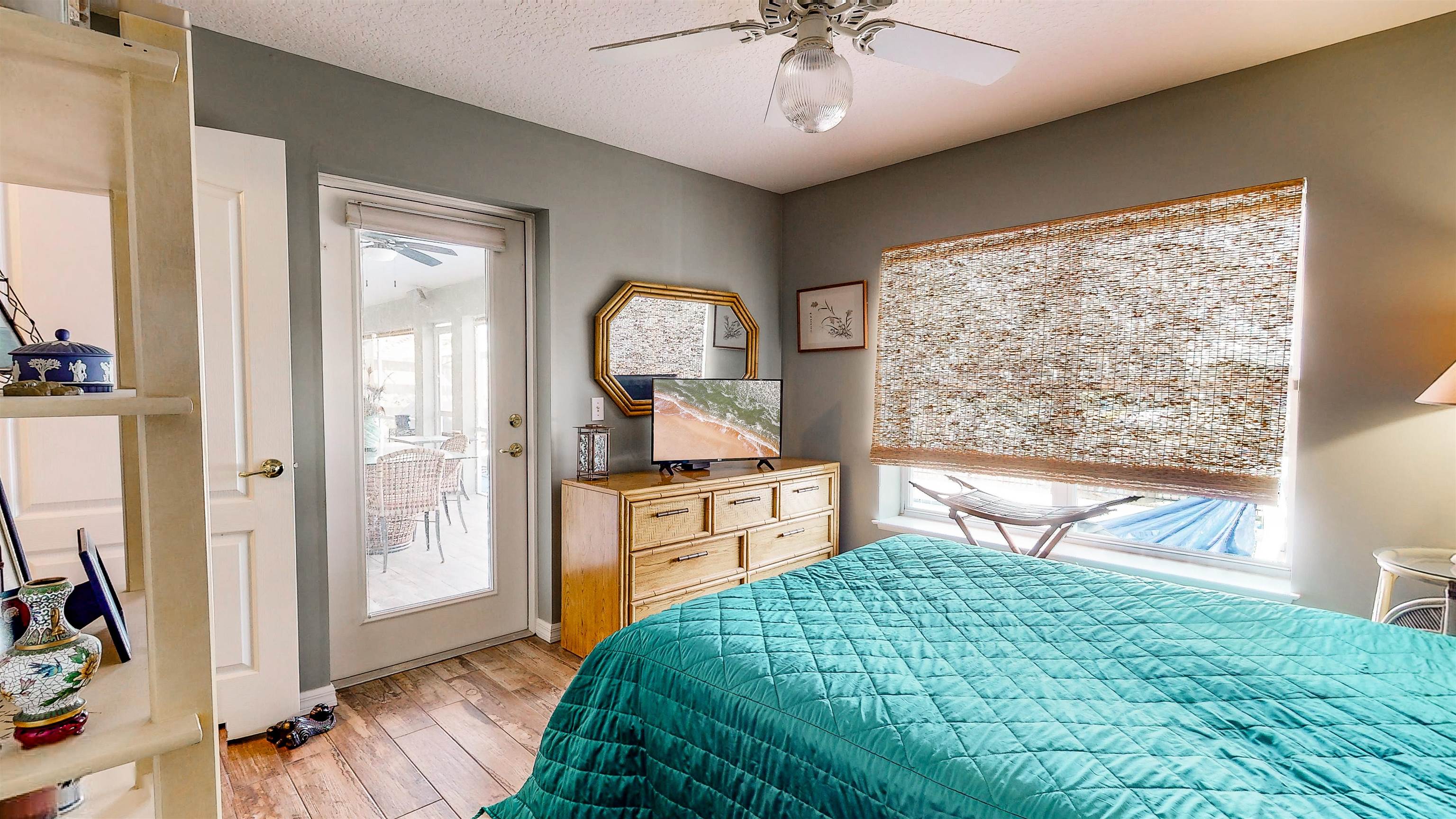 252 Desoto Road St. Augustine, FL 32080 - Photo 37 of 50 a bedroom with a bed and a chandelier