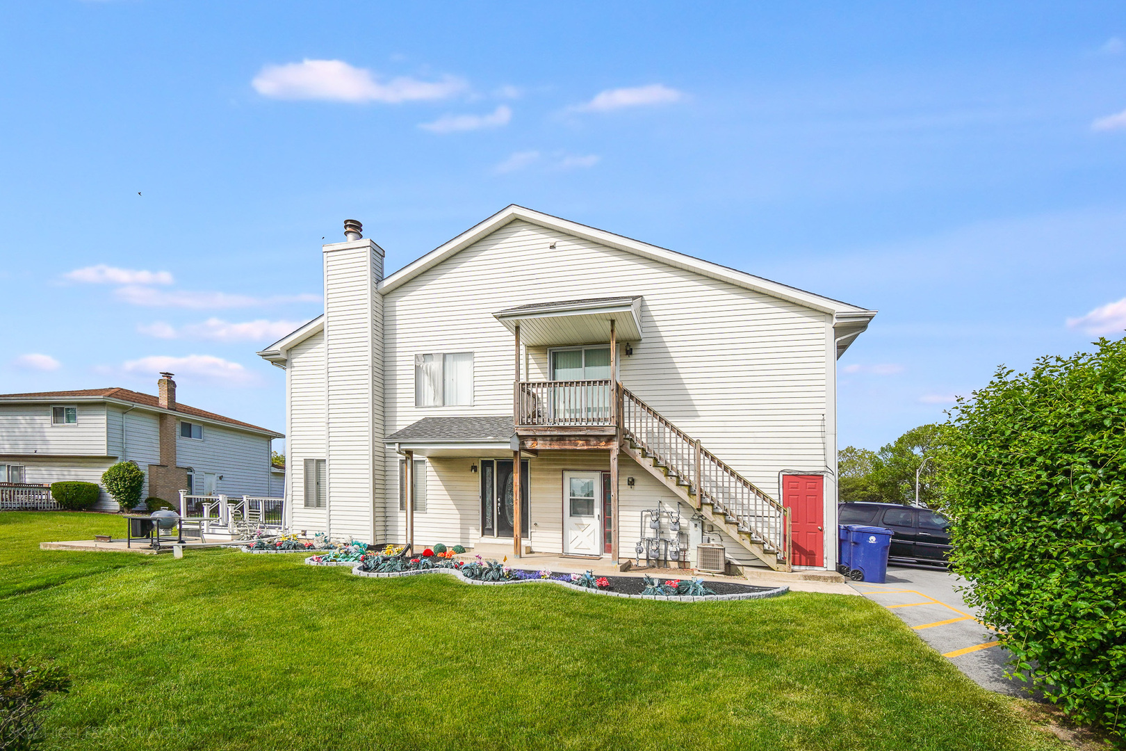 103 Red Barn Road, Unit 103 Matteson, IL 60443 - Photo 2 of 17 a front view of a house with a yard