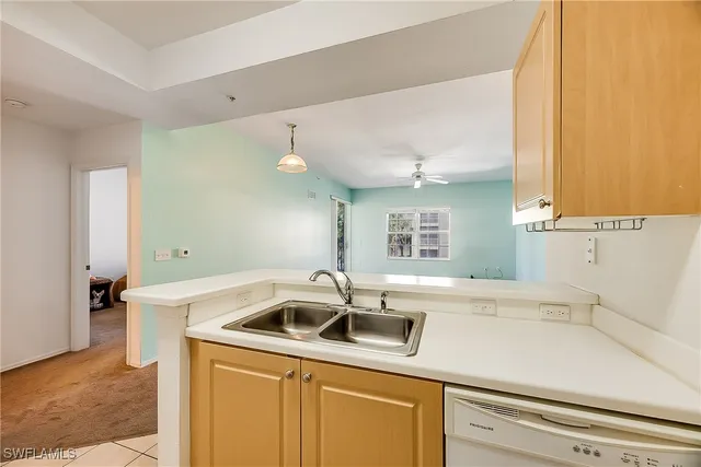 a kitchen with a sink and cabinets