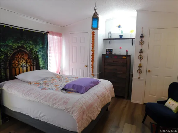 a bedroom with a bed and a fireplace