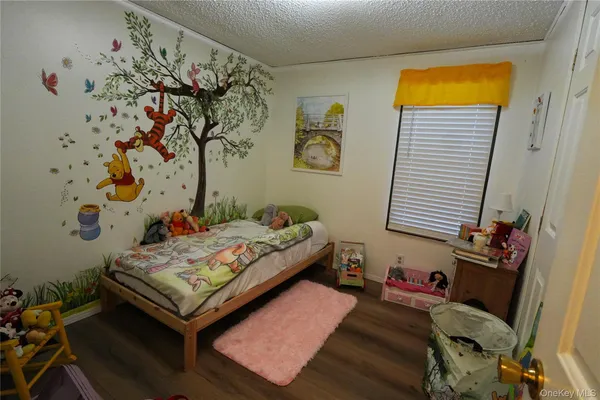 a bedroom with a bed and furniture
