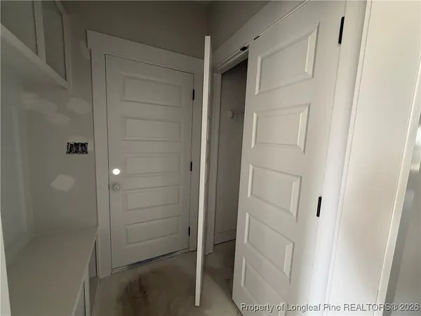 a view of an empty room with a cabinet