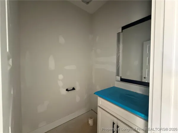 a view of kitchen with stainless steel appliances kitchen island sink and cabinets
