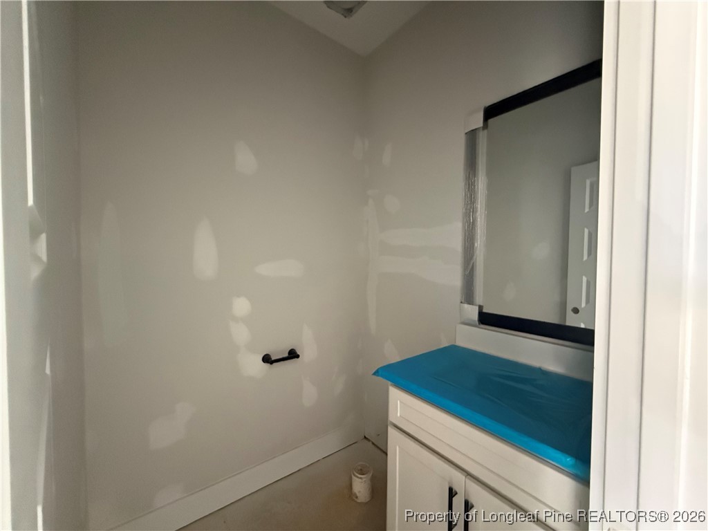 3929 Hamilton Street Hope Mills, NC 28348 - Photo 7 of 26 a bathroom with a sink and vanity