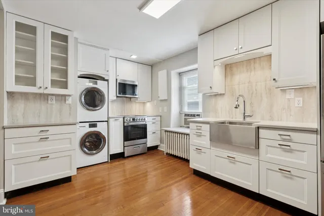 a bedroom with furniture and a wooden floor