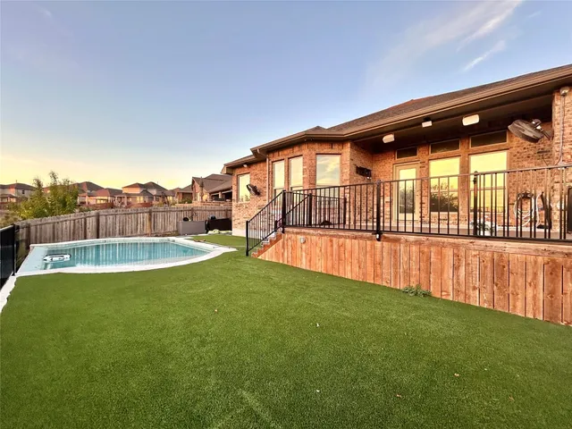 a view of kitchen and hall with wooden floor