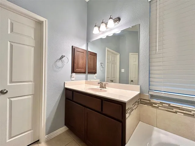 a white bath tub sitting in a bathroom