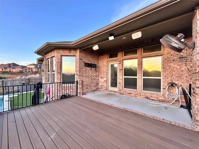 a view of a swimming pool with a yard