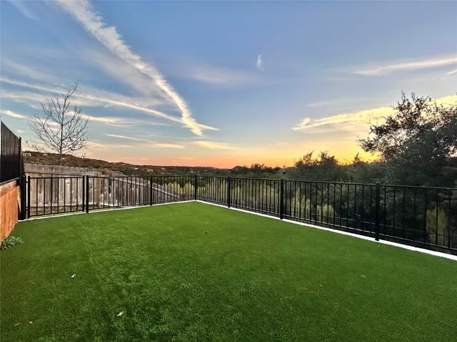a view of swimming pool with a yard