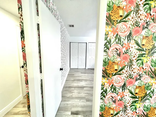a white toilet sitting next to a bathroom sink