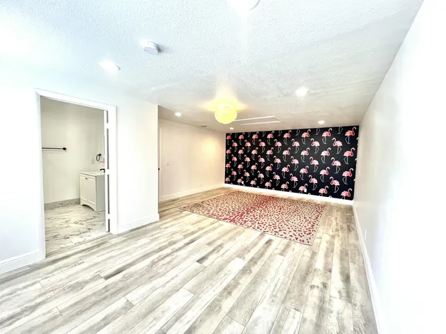 a front view of a house with a yard and a garage