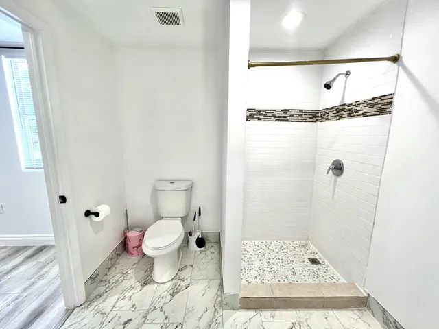 a view of balcony with wooden floor and fence