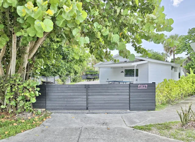 an aerial view of a house with yard