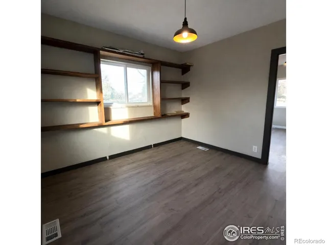 a bathroom with a shower a toilet and a sink