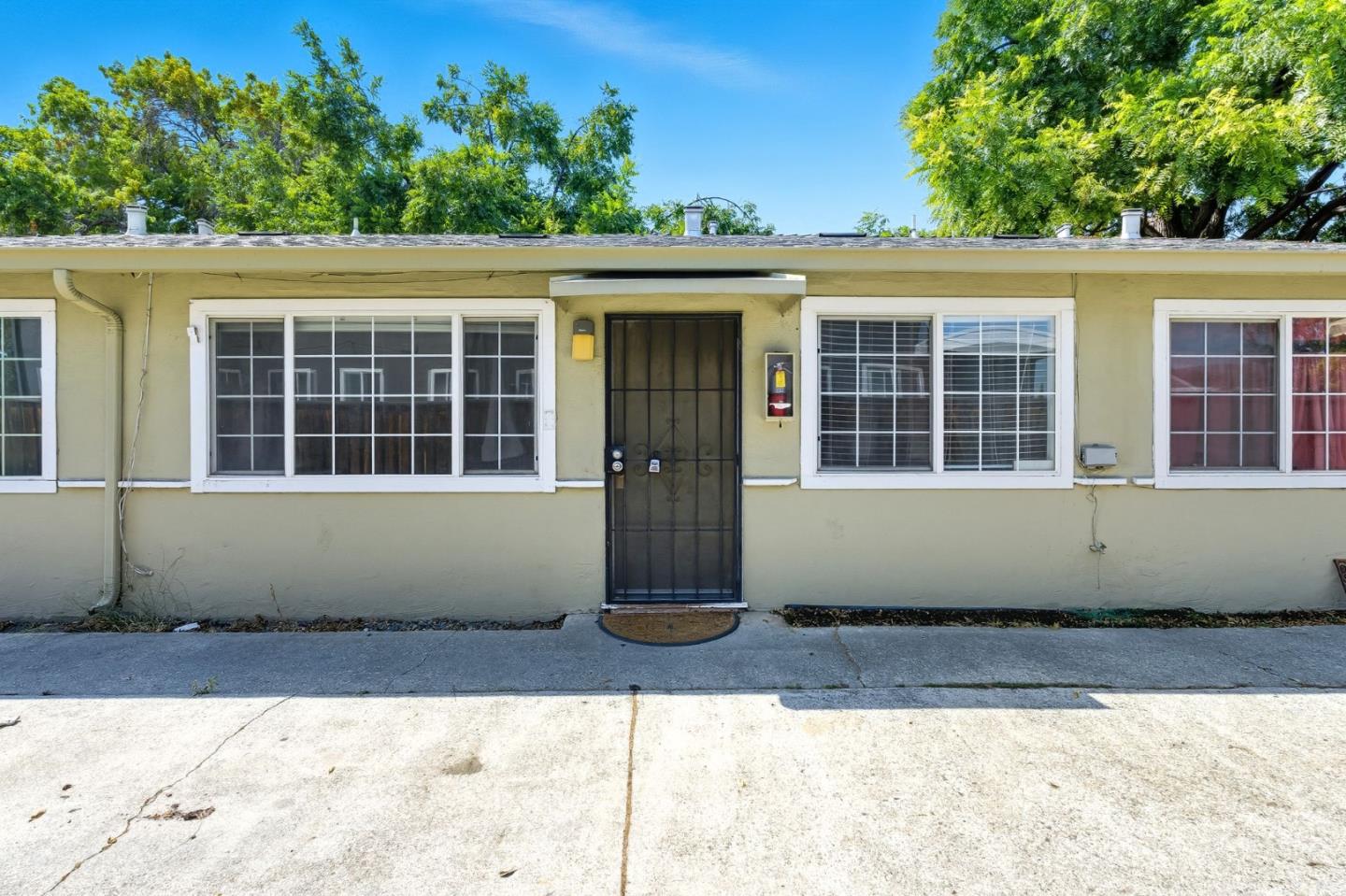 317 Perrymont Avenue San Jose, CA 95125 - Photo 4 of 25 a front view of a house with a yard