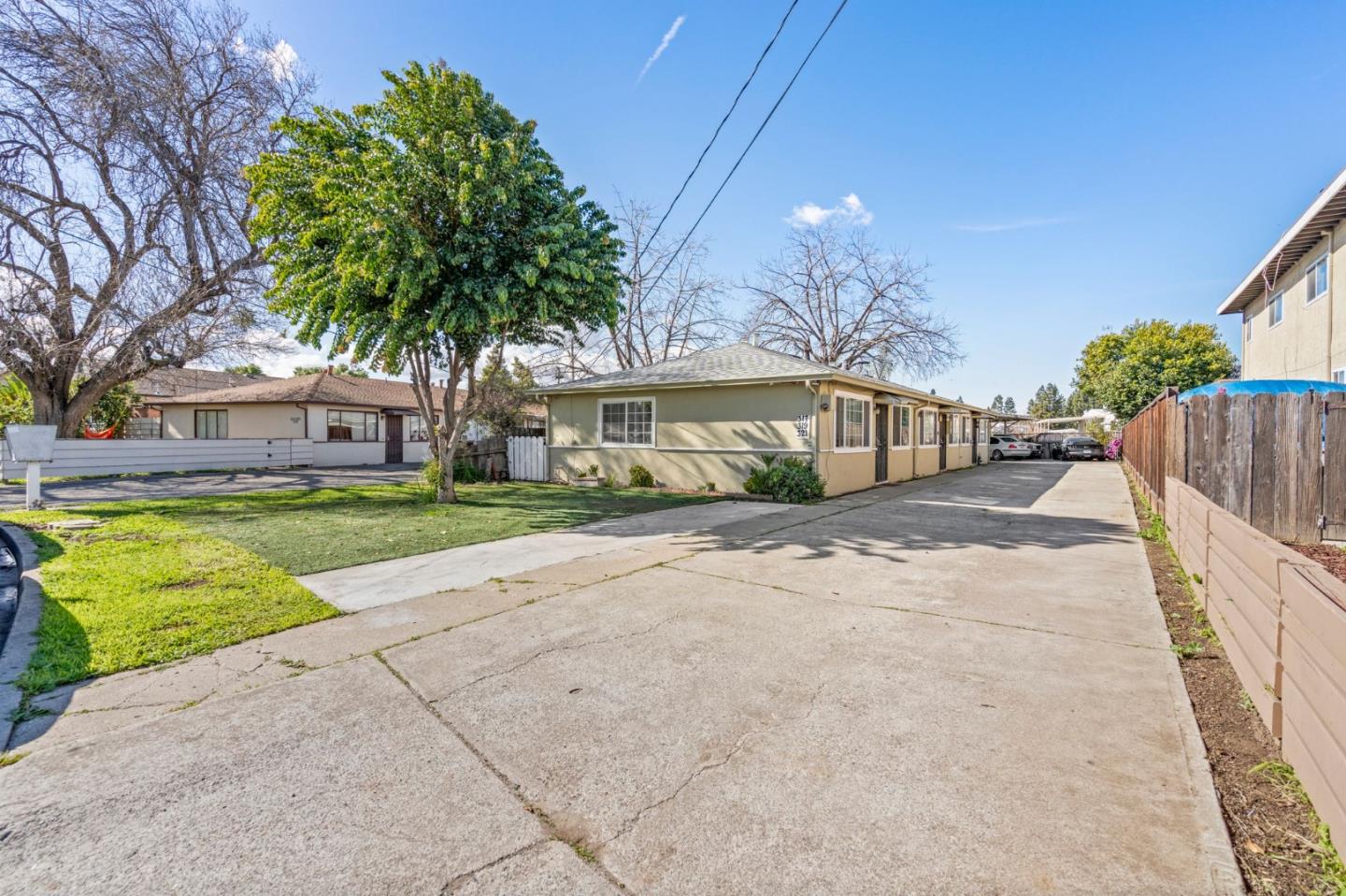 317 Perrymont Avenue San Jose, CA 95125 - Photo 6 of 25 a front view of a house with a yard and potted plants