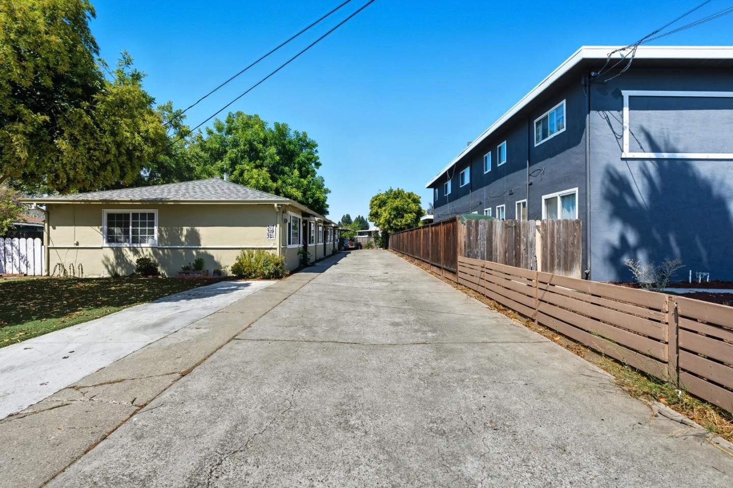 317 Perrymont Avenue San Jose, CA 95125 - Photo 7 of 25 a front view of a house with a yard