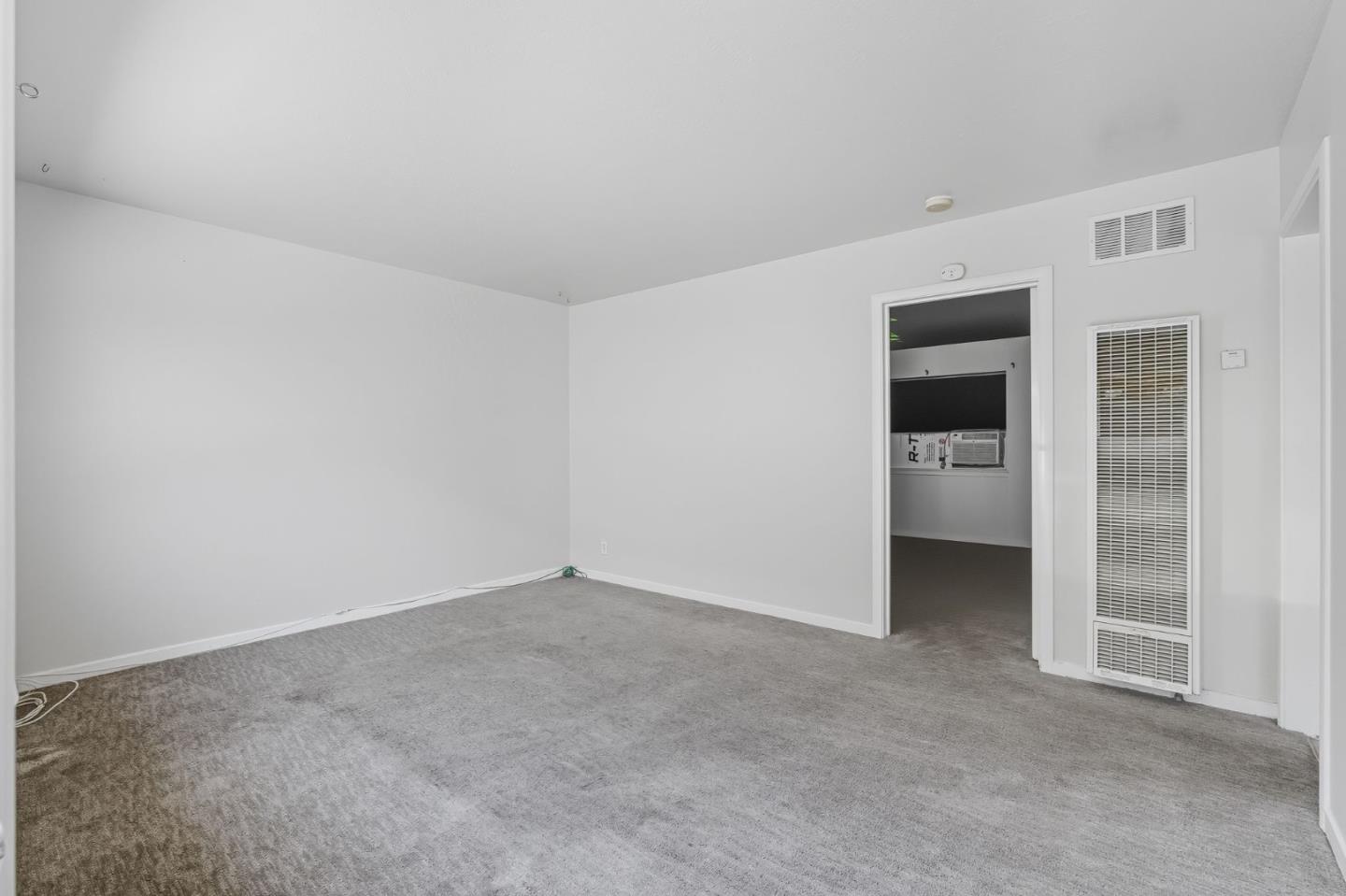 317 Perrymont Avenue San Jose, CA 95125 - Photo 9 of 25 an empty room with a kitchen