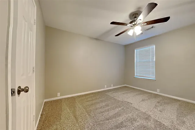 a view of a small space with a fan