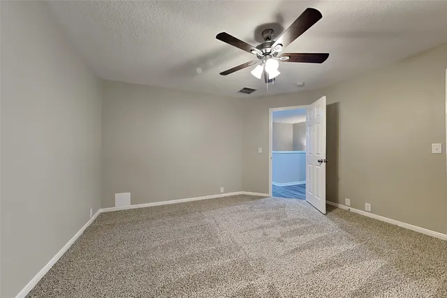 a view of room with ceiling fan