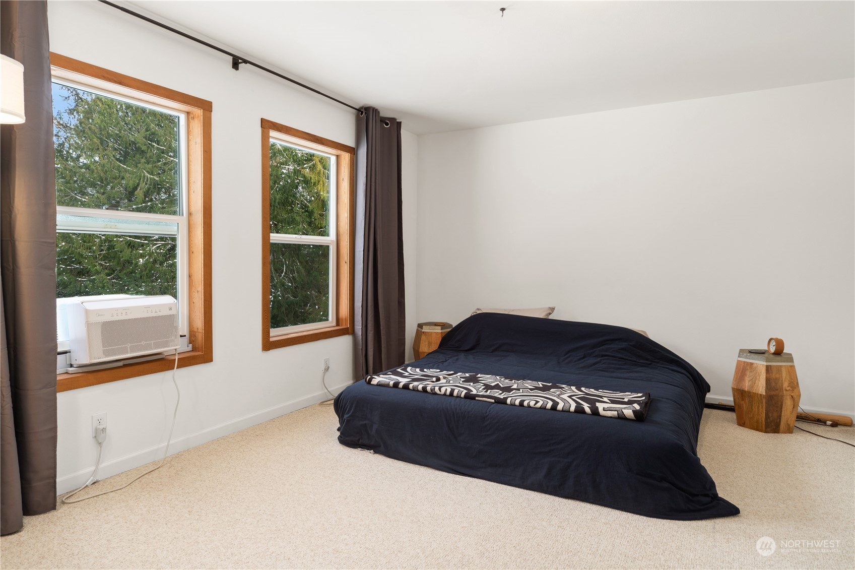 232 Peterson Road Port Townsend, WA 98368 - Photo 16 of 32 a bedroom with a bed and a large window