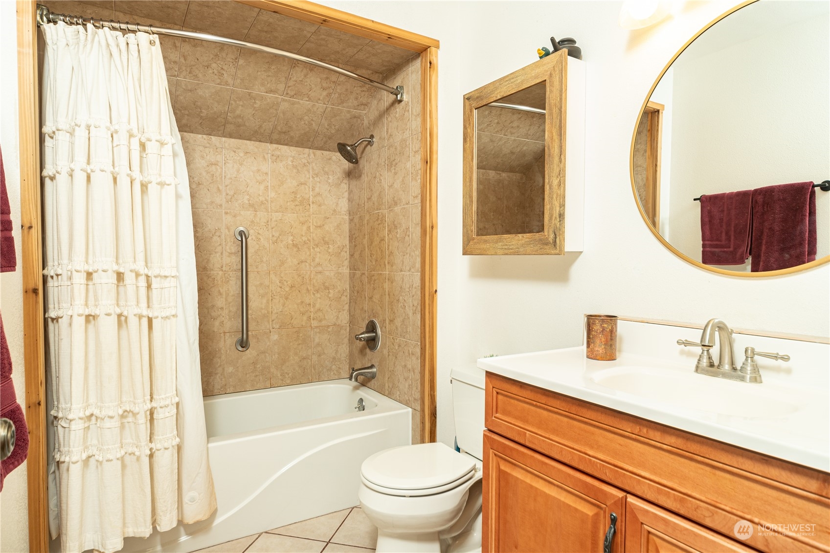 232 Peterson Road Port Townsend, WA 98368 - Photo 19 of 32 a bathroom with a sink a toilet and a mirror