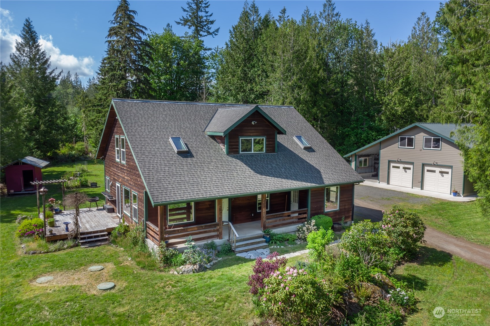 232 Peterson Road Port Townsend, WA 98368 - Photo 30 of 32 aerial view of a house with a big yard potted plants and large tree