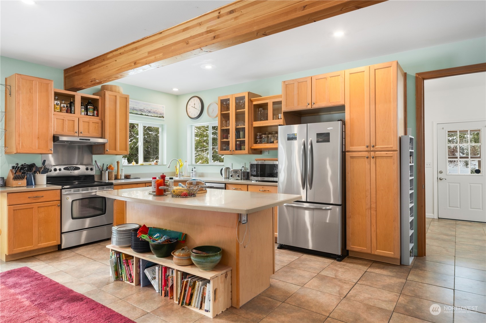 232 Peterson Road Port Townsend, WA 98368 - Photo 5 of 32 a kitchen with stainless steel appliances granite countertop a refrigerator and a stove top oven