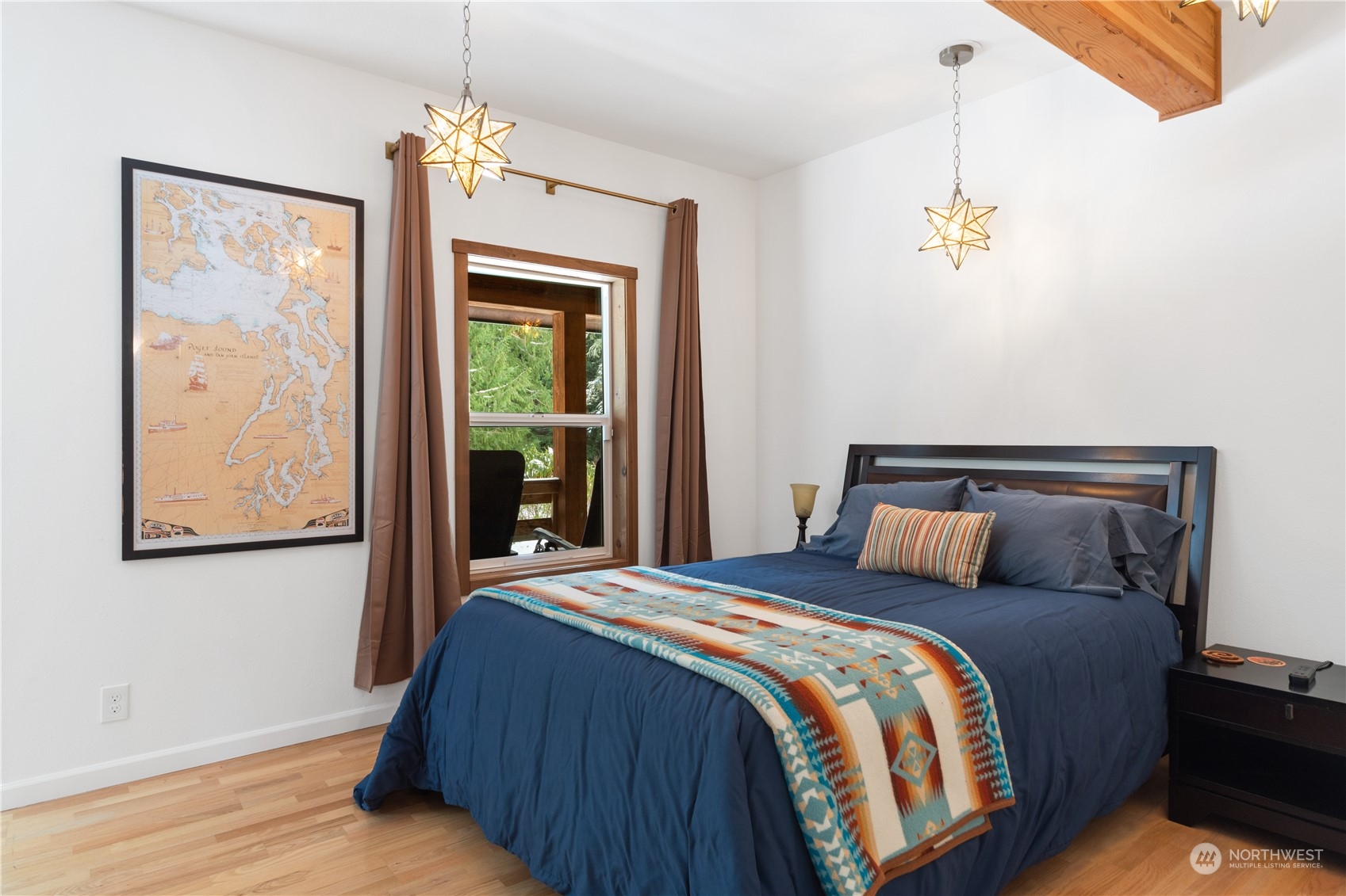 232 Peterson Road Port Townsend, WA 98368 - Photo 7 of 32 a bedroom with a large bed and a window
