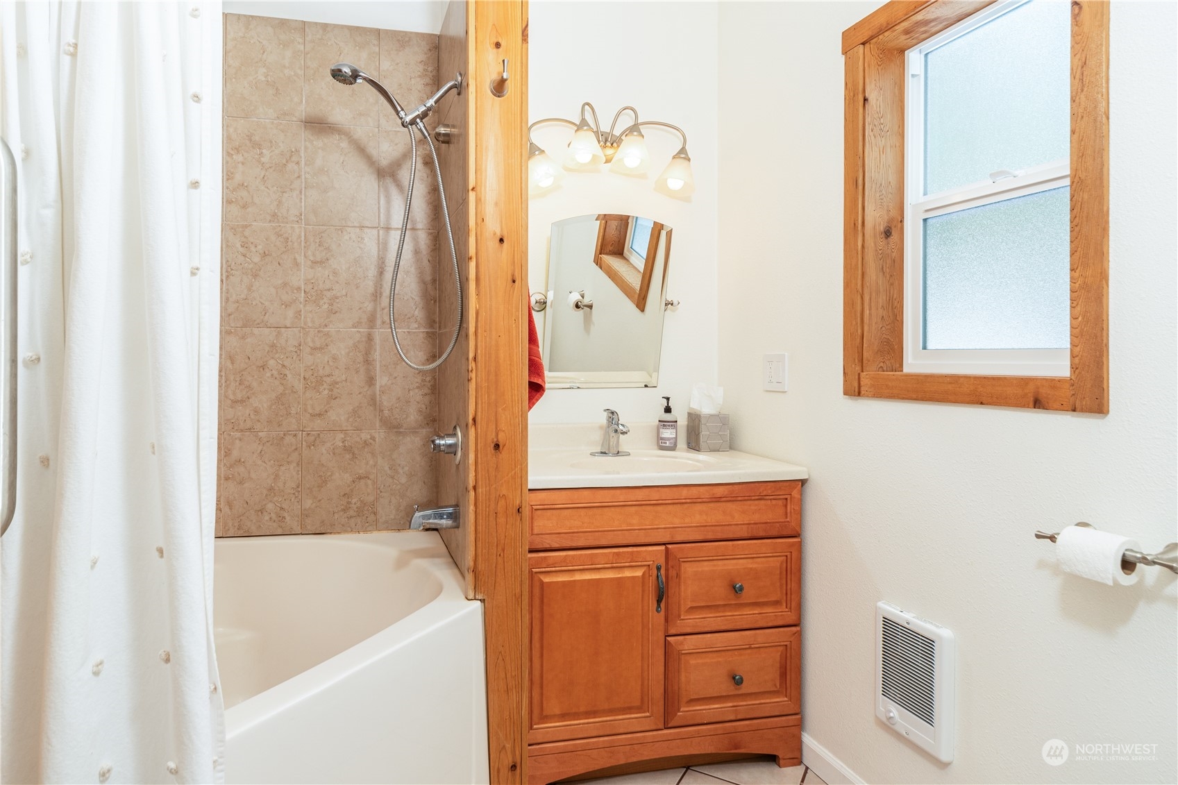 232 Peterson Road Port Townsend, WA 98368 - Photo 9 of 32 a bathroom with a tub sink and mirror