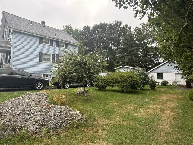 a front view of a house with garden