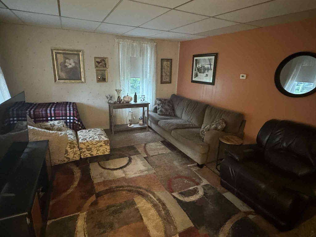 539 Aetna Street Fall River, MA 02721 - Photo 13 of 22 a living room with furniture rug and window
