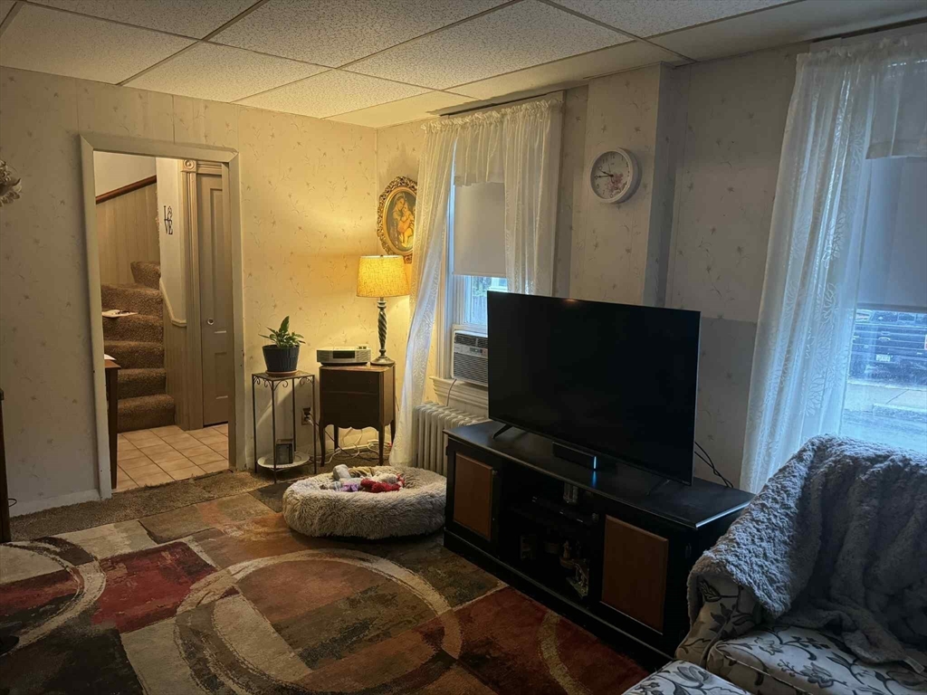 539 Aetna Street Fall River, MA 02721 - Photo 14 of 22 a living room with furniture and a flat screen tv