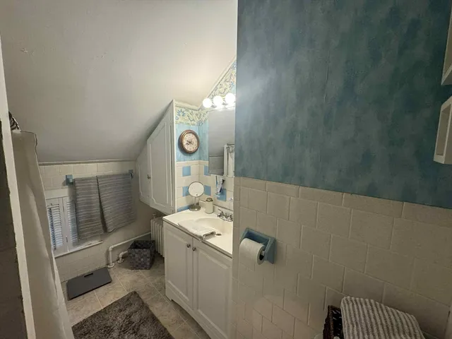 a bathroom with a sink toilet and vanity
