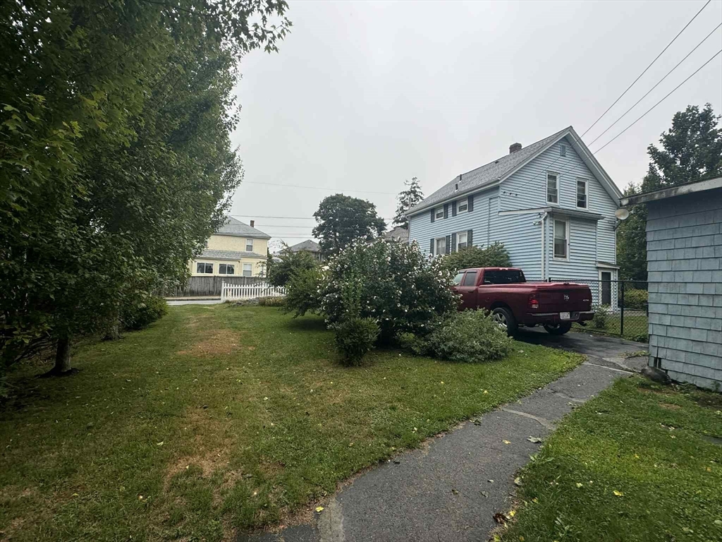 539 Aetna Street Fall River, MA 02721 - Photo 4 of 22 a front view of a house with garden