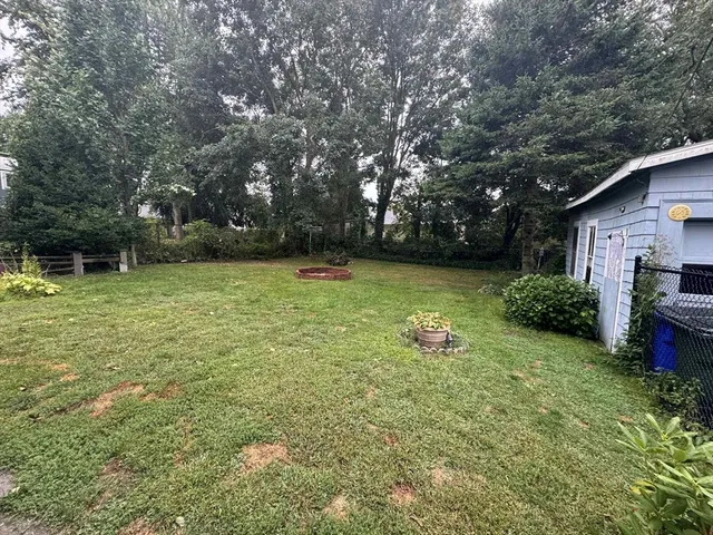 a view of a swimming pool with a yard