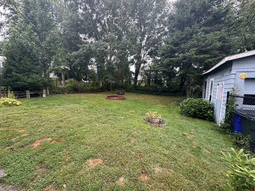 539 Aetna Street Fall River, MA 02721 - Photo 7 of 22 a view of a swimming pool with a yard