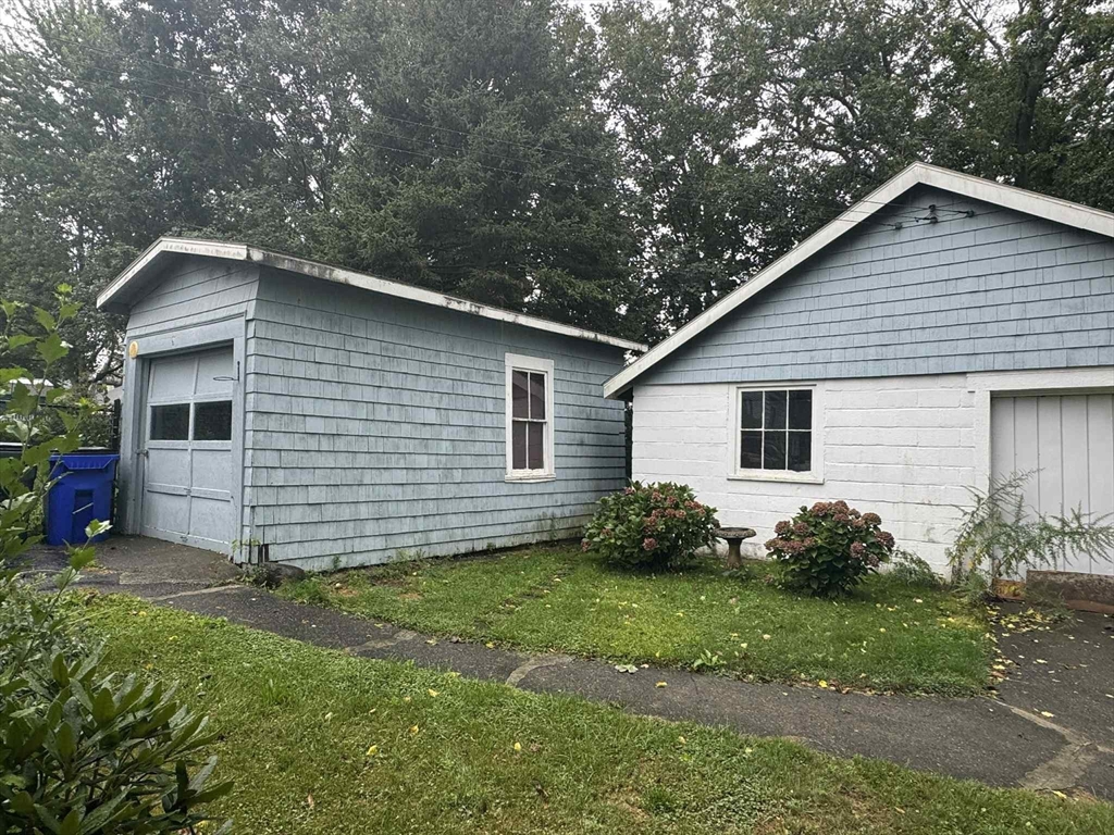 539 Aetna Street Fall River, MA 02721 - Photo 8 of 22 a view of a house with a yard