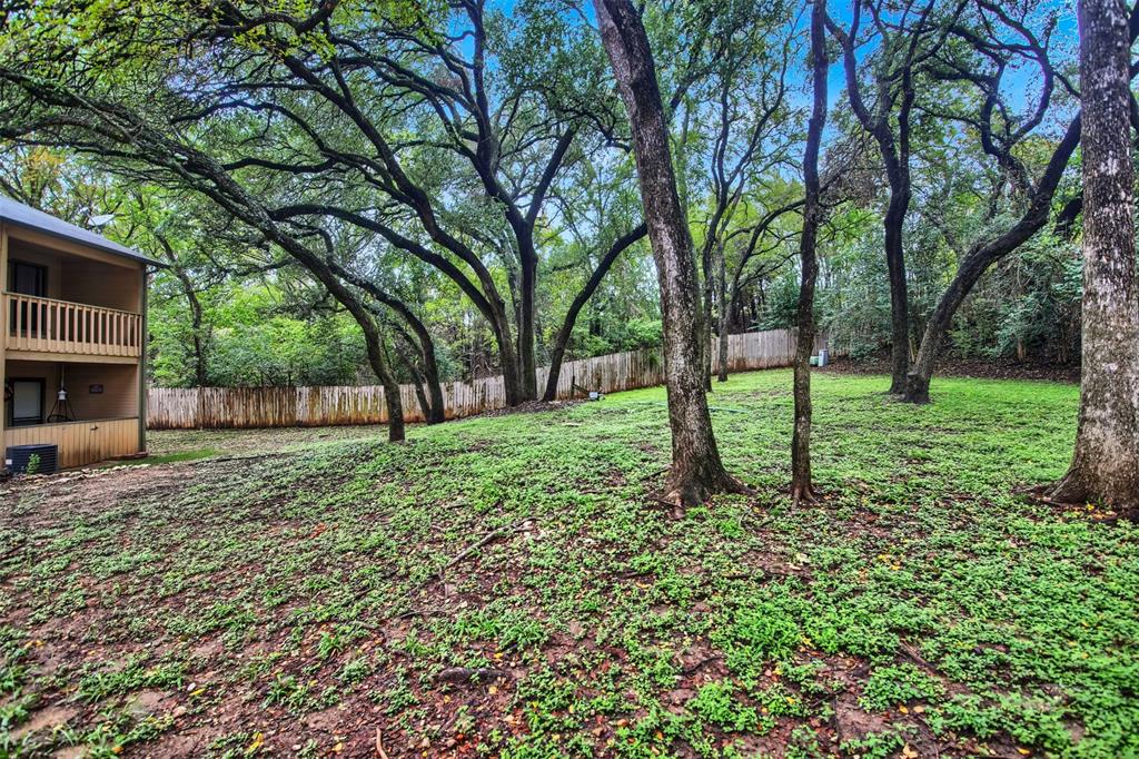 9100 Mountain Ridge Drive, Unit 102 Austin, TX 78759 - Photo 23 of 24 View of fenced yard