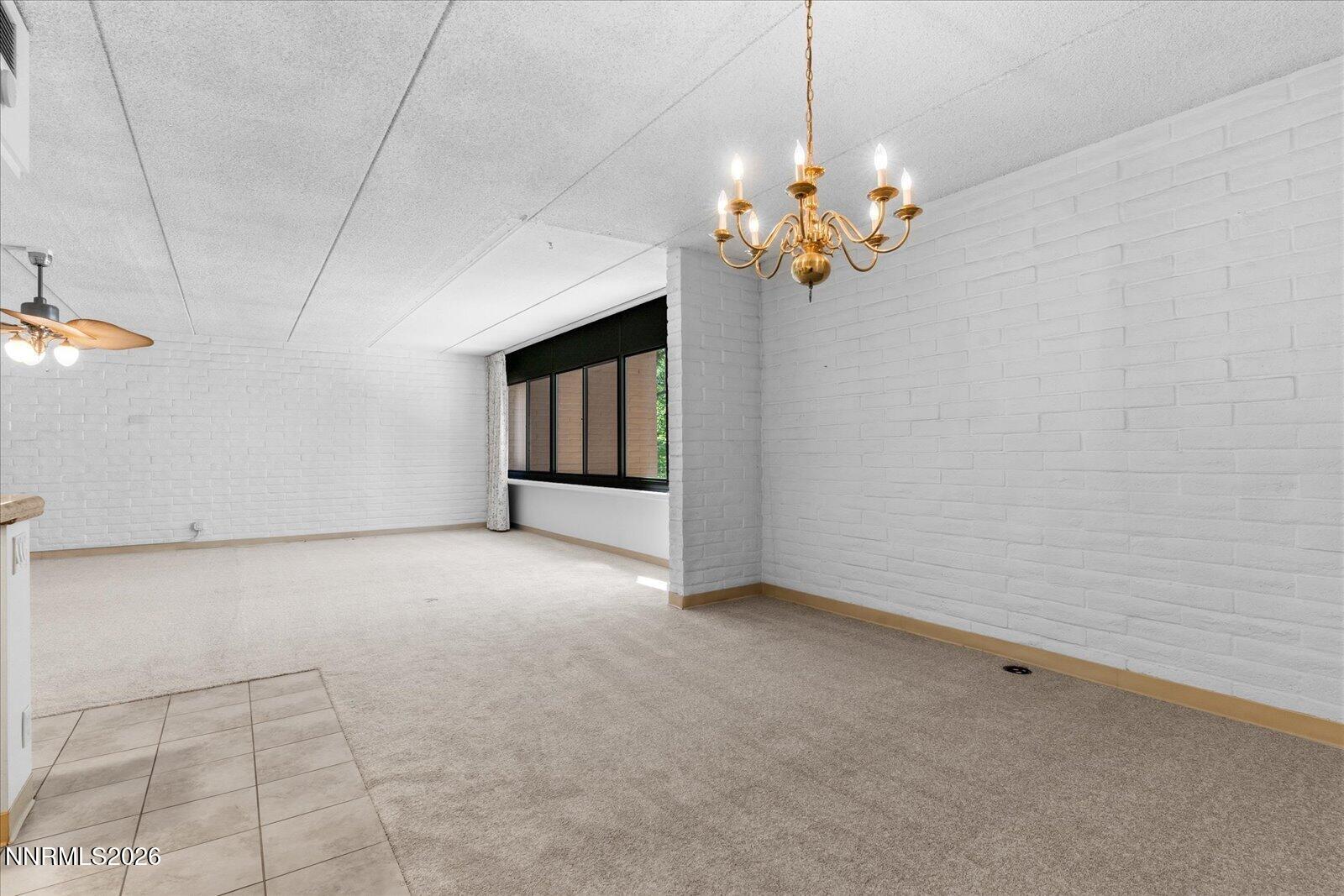 1200 Riverside Drive, Unit 1229 Reno, NV 89503 - Photo 22 of 51 a view of an empty room with a chandelier fan