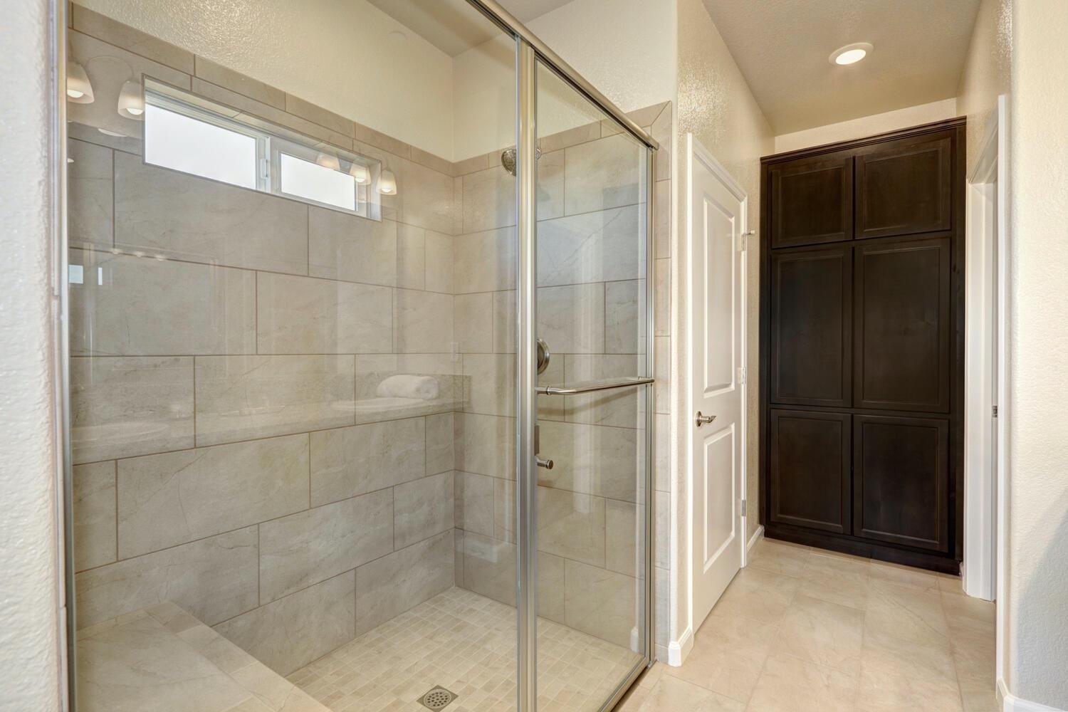1071 Hogan Road Galt, CA 95632 - Photo 17 of 17 *Owner's Suite Bathroom Large Walk-In Shower with Tile Surround