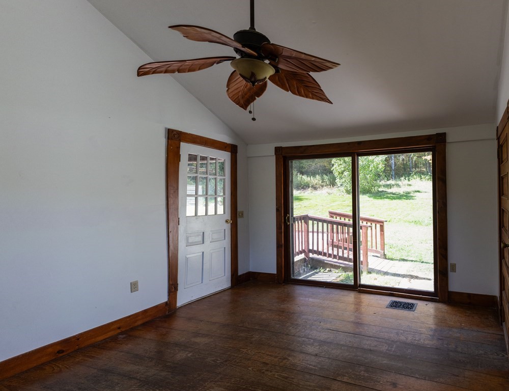 92 Burrington Road Heath, MA 01346 - Photo 5 of 30 a view of an empty room with wooden floor and a window